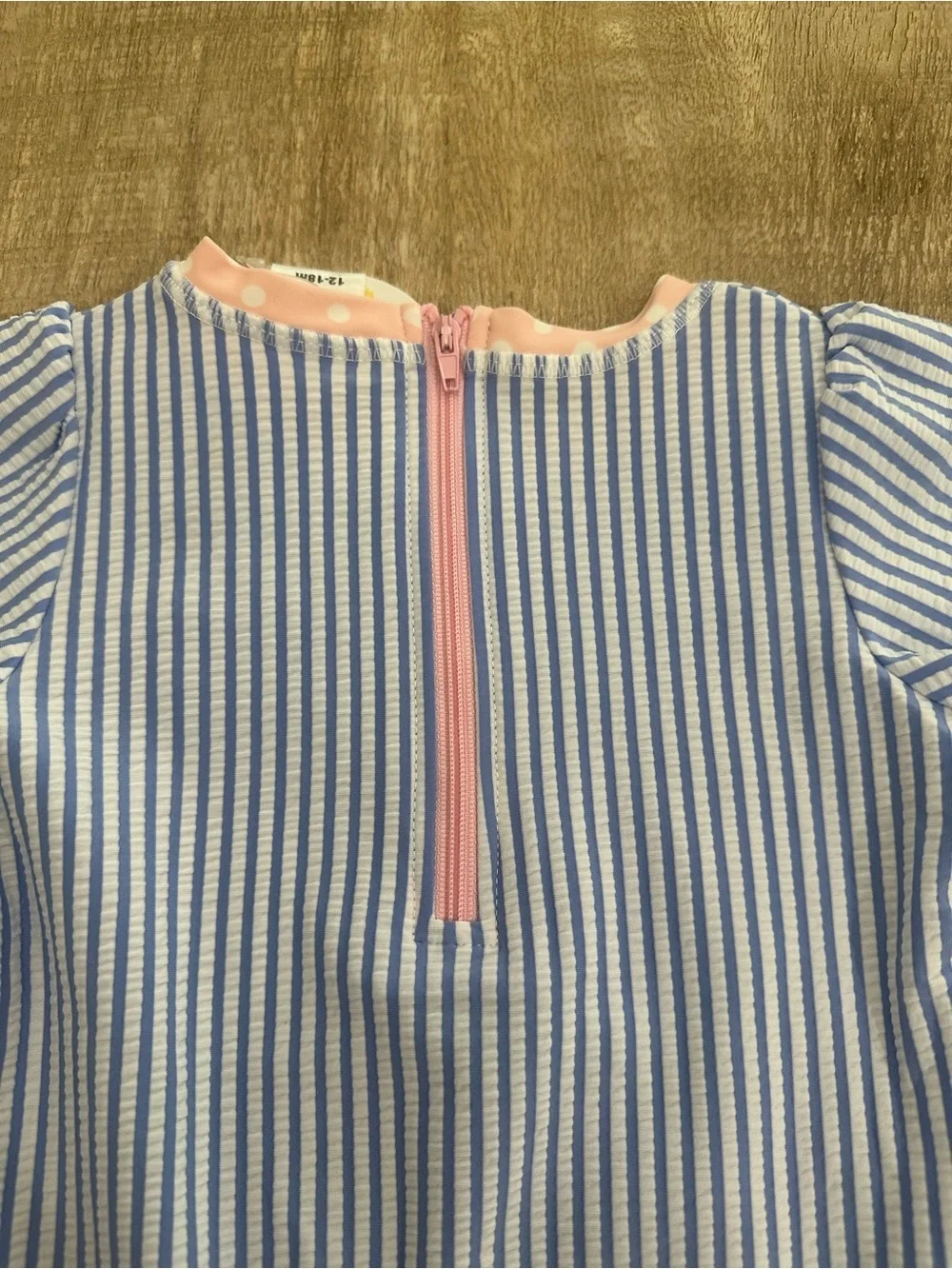 RuffleButts Blue Seersucker Rash Guard One Piece | 12–18M | UPF 50+